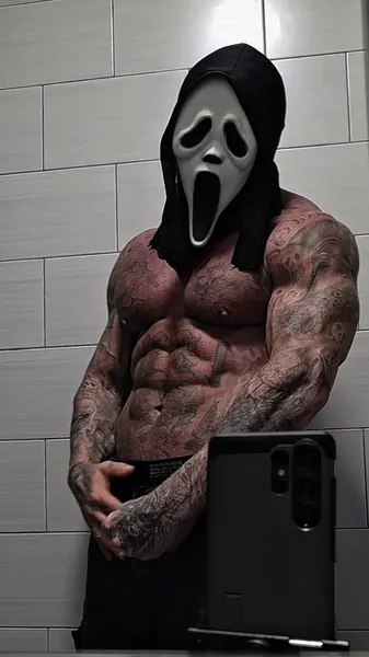 Zade, ghostface. Shirtless front pose against white tiles.