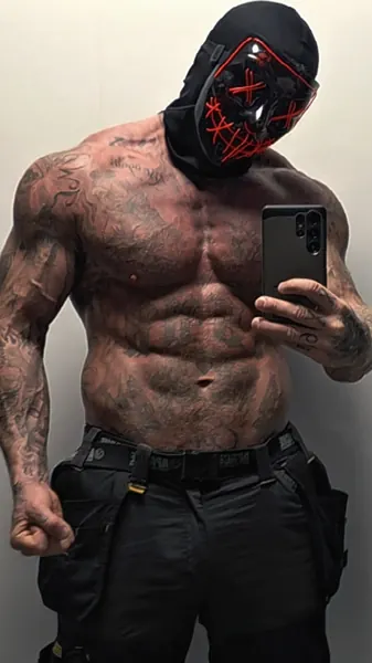 Zade, red LED purge mask. Shirtless mirror selfie, red LED mask.