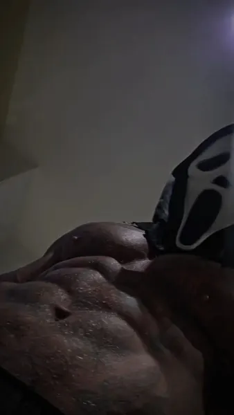Zade, ghostface. Low-angle moody abs close-up.