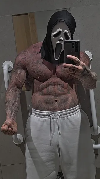 Zade, ghostface. Shirtless mirror selfie, grey joggers.